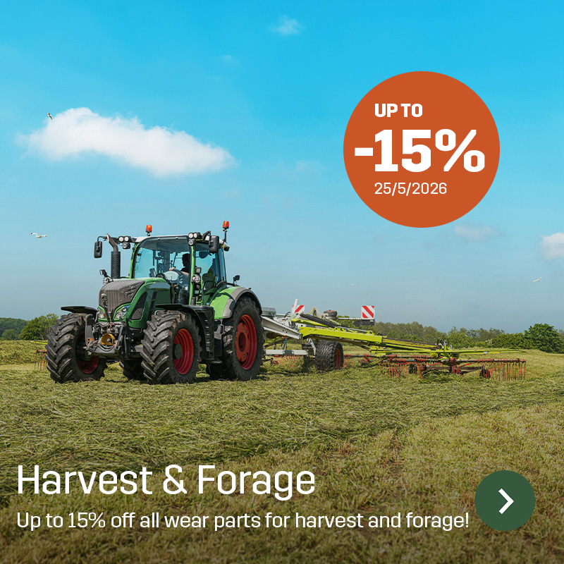 Tractor with a rotary rake working on a freshly cut grass field under a clear sky. Sagros campaign for wear parts within harvest and grassland equipment highlights up to 15% discount on spare parts and accessories.