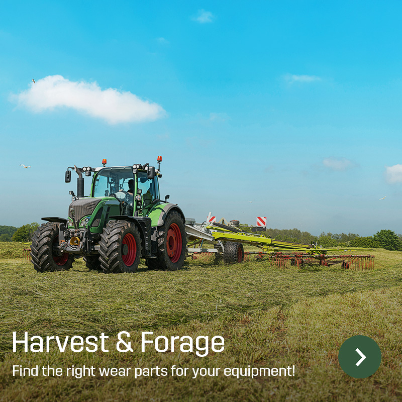 Tractor with rake working on a harvested field under a clear sky. Sagros wear parts and spare parts for forage harvesting and grassland equipment are shown in use on agricultural machinery.