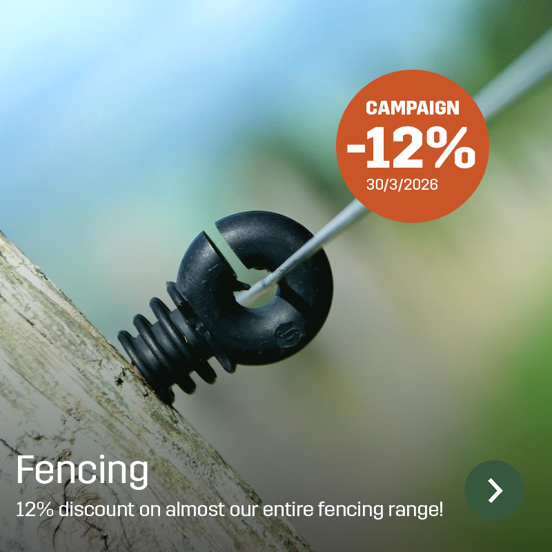 Close-up of a black fence insulator mounted on a wooden post with electric wire inserted. Sagros spare part is used to keep the wire insulated and properly positioned in fencing for grazing areas.